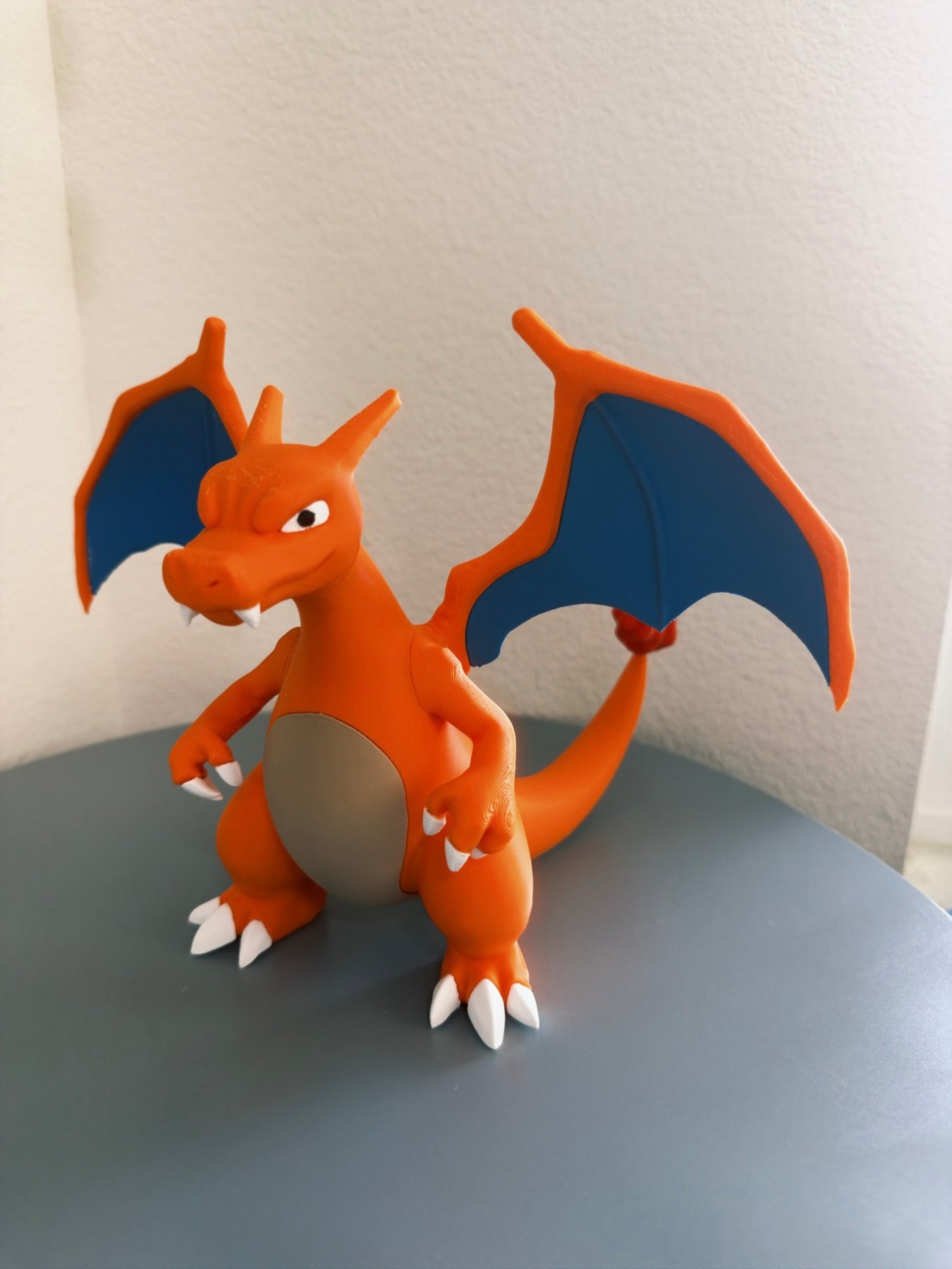 Hand-painted custom Charizard figure printed and finished by 11:11 Printlab