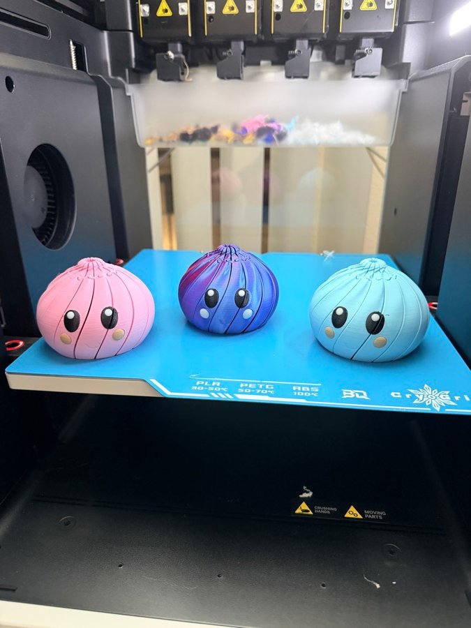 Three blob characters on the printer build plate