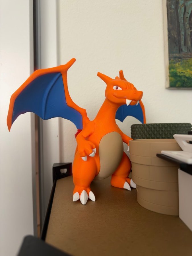 Orange dragon figure on a shelf