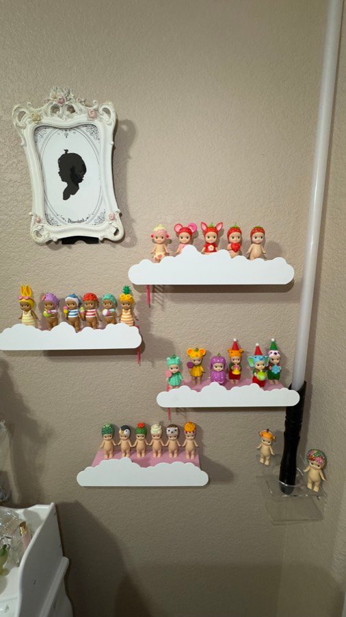 Cloud-shaped printed shelves displaying collectibles