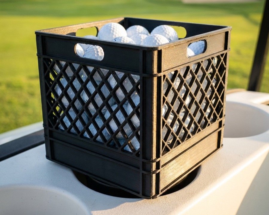 Golf Ball Milk Crate: a black 3D printed milk crate full of golf balls sitting in the cup holder of a golf cart