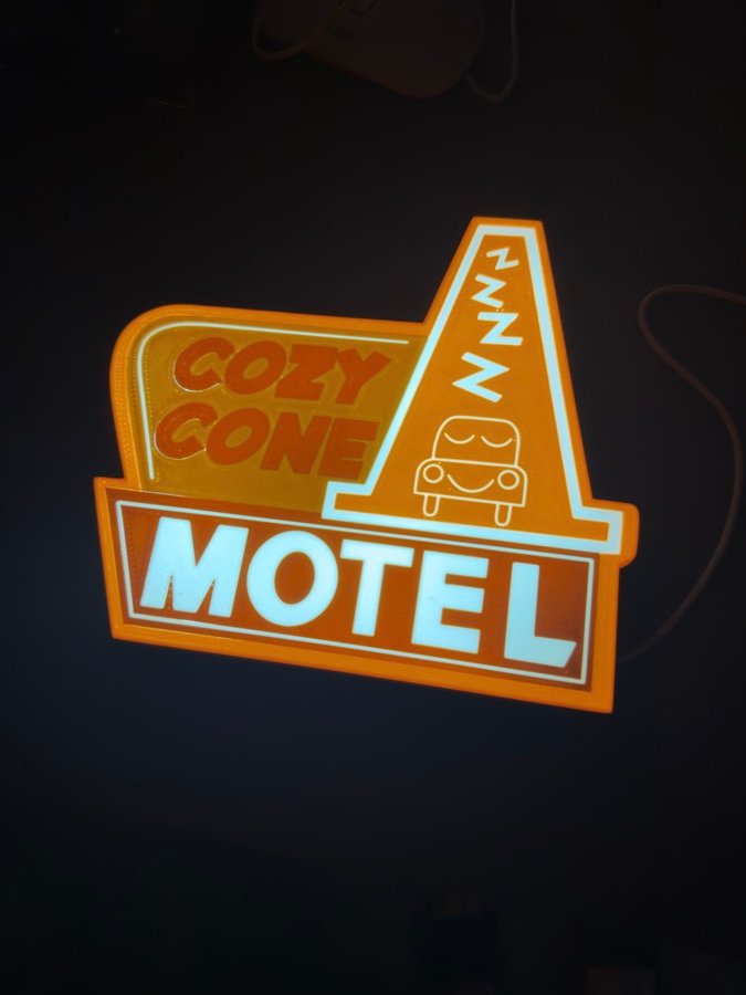 Glowing motel sign printed in layers