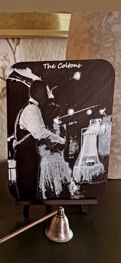 Framed lithophane print on a display stand