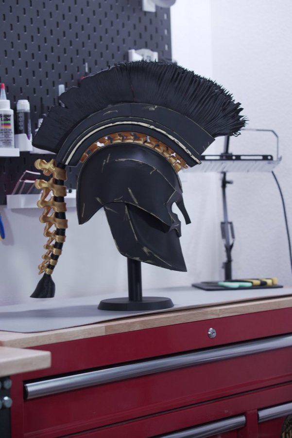 Rear view of the Spartan helmet with braided gold detail