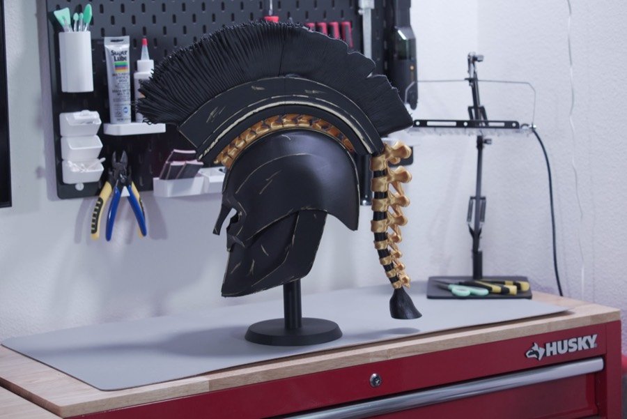 Spartan helmet on its stand in the workshop