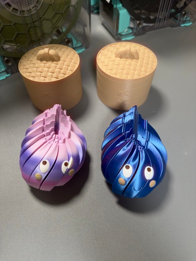 Close-up of the pink and blue twisty blob characters